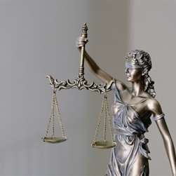 A statue holding a set of judicial scales