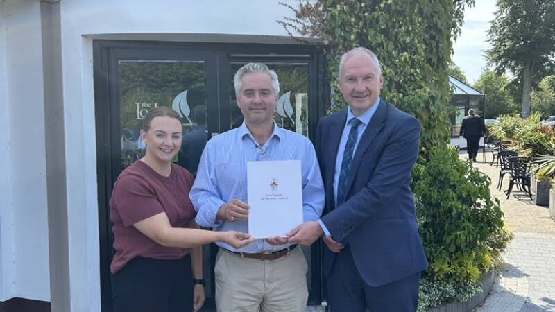 Secretary of Ballymoney and Coleraine Association Sinead Ingram LLB with Chair Christopher Clarke and Society President Mark Borland