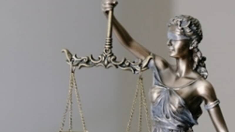 A statue holding a set of judicial scales